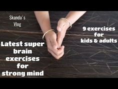 two hands holding each other on top of a wooden table with text that reads, the latest super brain exercises for strong mind