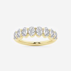 a yellow gold ring with five diamonds