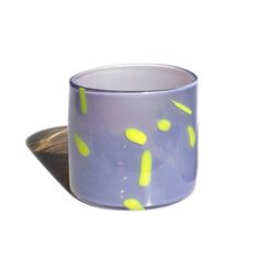 a purple cup with yellow dots on it