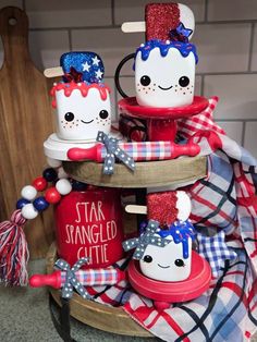 three red, white and blue patriotic mason jars are stacked on top of each other