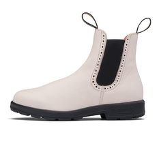 Step up your style game with the Blundstone Original 2156 High Top Chelsea Boot in Pearl. This bold and simple color choice will make you stand out and elevate every outfit choice. Premium water-resistant leather Elastic side Classic brogue detailing Leather lined Durable TPU outsole Cushioned midsole for comfort SPS Max Comfort system for outstanding shock absorption Removable footbed Lightweight and comfortable Blundstone Style, Mens Blundstone, Australian Boots, Blundstone Women, Blundstone Shoes, White Leather Boots, Womens Casual Boots, Top Pearl, Blundstone Boots