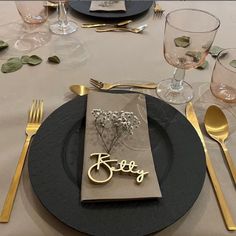 a place setting with silverware and napkins