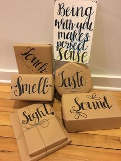 some boxes that are sitting on the floor with writing on them, and one box is empty