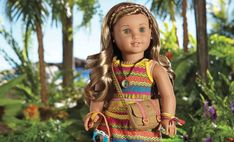 the doll is wearing a colorful dress with braids on it's head and holding a handbag