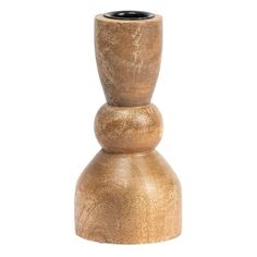 a wooden vase sitting on top of a white surface