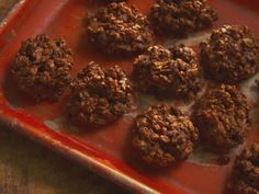 a red tray filled with cookies on top of a table