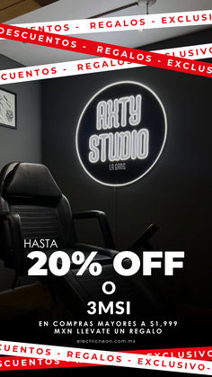 a black chair sitting in front of a neon sign that says arty studio 20 % off