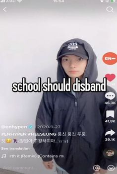 a young boy wearing a black jacket and hat with the words school should disband