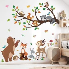 an animal themed wall decal in a child's room with forest animals and leaves