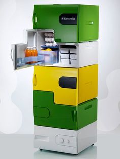 an open refrigerator sitting on top of a white counter next to another green and yellow fridge