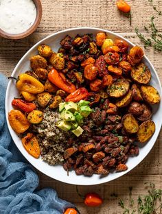 a white bowl filled with different types of food