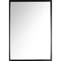 a black framed mirror sitting on top of a white wall