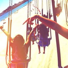 two people sitting on swings with the words always have fun