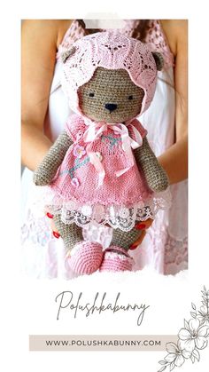 a teddy bear wearing a pink dress and bonnet is posed in front of a white background