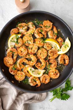 shrimp with lemon and parsley in a skillet