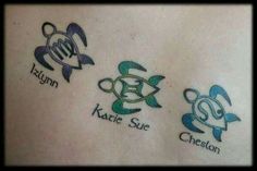 three small tattoos on the back of a woman's stomach, each with two different sea animals