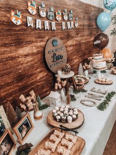 a table topped with lots of food and desserts