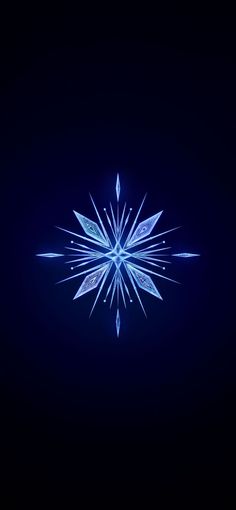 a snowflake is shown in the dark with blue light coming from its center