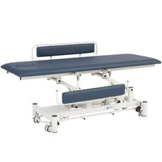 a hospital bed sitting on top of a white table