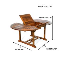 a wooden table with measurements for the top and bottom section, including an open laptop on it