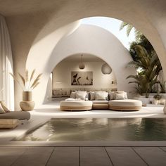 a living room with a pool and couches in front of an archway that leads to the outside