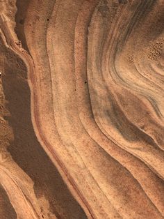 an aerial view of sand and water in the desert