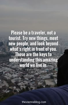 a man standing on top of a tall building next to a sky line with the words, please be a traveler, not a tourist try new things, meet new people, and look beyond what's