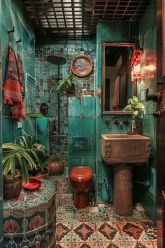 a bathroom with green walls and tiled flooring, potted plants on the wall