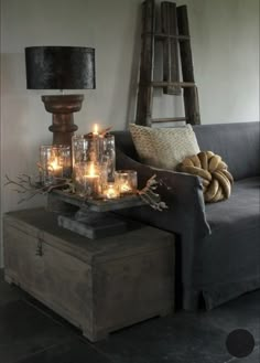 a living room with candles on the coffee table