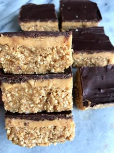 chocolate and peanut butter bars stacked on top of each other