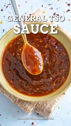 a spoon full of sauce in a bowl with the words general tso sauce above it