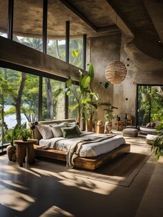 a large bed sitting inside of a bedroom next to a window covered in greenery