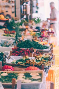 many different types of fruits and vegetables on display