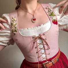 Walking Through Woodlands 🌿 | The Strawberry Corset Top 🍓*SOLD* This corset top is the perfect ode to one of spring's dearest delights: the humble but ever-lovely… | Instagram Hobbitcore Accessories, Corset Outfit Cottagecore, Ren Faire Outfits Cottagecore, Pink Ren Faire Outfit, Cottagecore Bodice, Corset With Shirt Under, Renfaire Outfit Ideas, Strawberry Cosplay, Corset With Dress