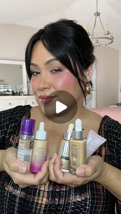 a woman holding three different types of skin care products in her hands and smiling at the camera