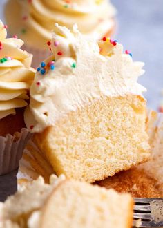 cupcakes with white frosting and sprinkles on top