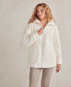 Wrap yourself in the embrace of the Ann Taylor Haven Well Within Sherpa Zip Jacket, where comfort meets sustainable chic. This ivory sherpa jacket is a must-have for those who value both style and environmental consciousness.

- **Size**: Large
- **Color**: Ivory
- **Material**: 100% Recycled Polyester
- **Gender**: Female
- **Fit**: Relaxed
- **Length**: 28 1/2 inches
- **Features**: Long sleeves, on-seam pockets, full-zip style, foldover collar
- **Care**: Machine washable

Designed for the mo Comfortable Soft Outerwear For Loungewear, Soft Texture Outerwear For Loungewear, Comfy Cozy Fit Soft Outerwear, Comfy Soft Outerwear, Cozy Snug Outerwear For Loungewear, Snug Cozy Loungewear Outerwear, Cozy Fall Outerwear For Relaxation, Cream Soft Texture Outerwear For Loungewear, Cozy Winter White Fleece Jacket