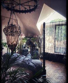 a bedroom with a large bed and lots of plants