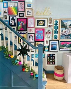 the stairs are decorated with colorful pictures and garlands on each handrail, along with a star