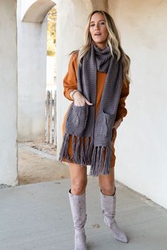 Cozy up in our oversized Kolbie Knitted Pocket Scarf, wrap two or three times for a Fall accessorized finish. It'll be your go-to on a Winter day because it features: Cozy, chunky, soft yarns Oversized Pocket details Fringe bottom ends *Due to lighting and differences in monitors, actual colors may vary slightly from what appears online. Model is 5'8" and wearing a size OS. Approximate measurements are as follows: OS: 110 "x 13" 100% Acrylic Hand wash cold, Lay flat to dry Import Pocket Scarf, Pocket Scarves, Three Bird Nest, Chunky Scarves, Rust Dress, Soft Yarn, Winter Day, Sweatshirt Dress, Pocket Detail