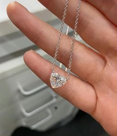 THE NECKLACE DISPLAYED IN THE PICTURES FEATURES A 3 CARAT LAB GROWN DIAMOND A heart-shaped diamond (or moissanite) necklace, featuring a minimalist design, epitomizes elegance through its simplicity. The diamond (or moissanite) delicately set without bezel takes center stage without distraction. The chains are available in different length ranging from 14 inches to 18 inches, available in 14K, 18K gold karats or sterling silver, and is available white, yellow, or rose color. You may also choose Luxury Heart Cut Brilliant Solitaire Necklace, Heart Shaped Diamond Necklace, Carat Sizes, Heart Knot, Casual Necklaces, Heart Necklace Diamond, Moissanite Necklace, Heart Shaped Necklace, Diamond Necklaces