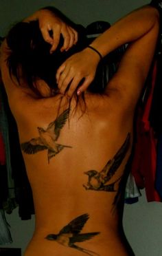 a woman with birds on her back