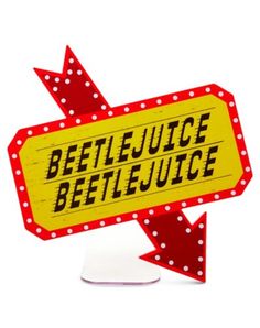 a red and yellow sign that says beetlelejuice with an arrow pointing to it