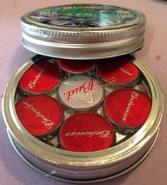 a metal container filled with lots of red candy