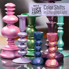 many different colored candles are on the table