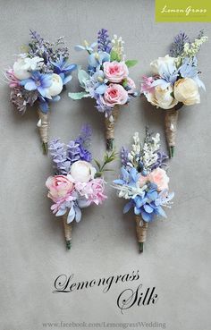 four bouquets of flowers are arranged on the wall