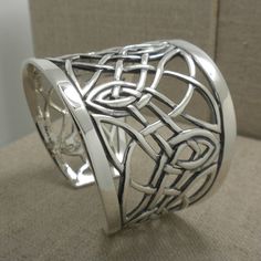 "Pretty Elven Celtic Knot Cuff Bracelet Sterling Silver 2\" at widest point on front. Tapers to 1\" at back. Opening at back just about 1\" Best for wrist size 6.5\" and 7\" 67.6 grams Imported from Canada Signed by the Artist Celtic Trinity Knot Cuff by Keith Jack Jewelry  Imported from Canada In Stock! Ships Immediately. Ships Free within the USA 21 Day Returns Items must be returned in new unworn condition." Celtic Accessories, Celtic Jewellery, Silversmithing Jewelry, Celtic Bracelet, Celtic Trinity Knot, Celtic Knots, Trinity Knot, Celtic Rings, Cuff Bangle Bracelet