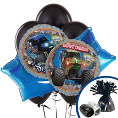 some balloons are in the shape of monster trucks with blue streamers and silver foil