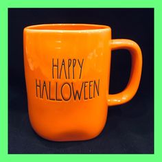 an orange coffee mug with the words happy halloween written on it