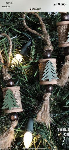 the christmas tree is decorated with wood and burlucks, pine cones and lights